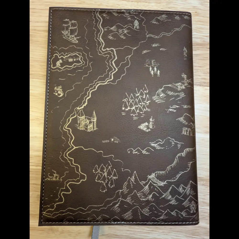Brown leatherette journal with gold laser engraved fantasy map.