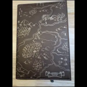 Brown leatherette journal with gold laser engraved fantasy map.